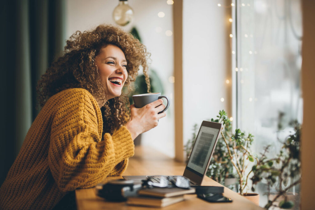 Young woman Enjoying of work and coffee